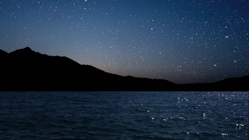 night landscape at sea with waves and stars