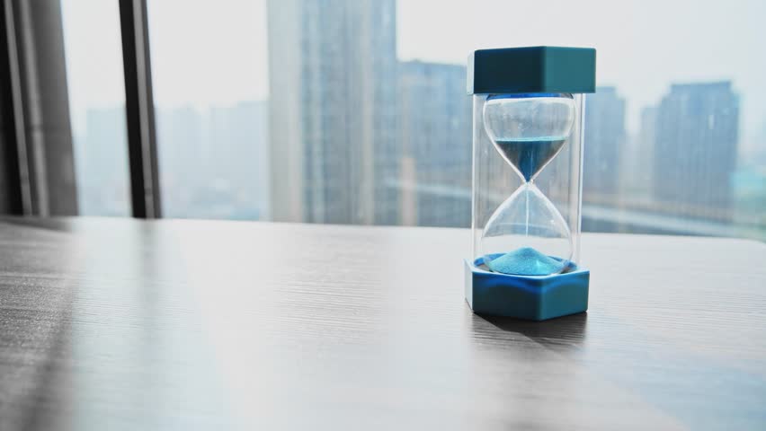 Single hourglass on the table of room