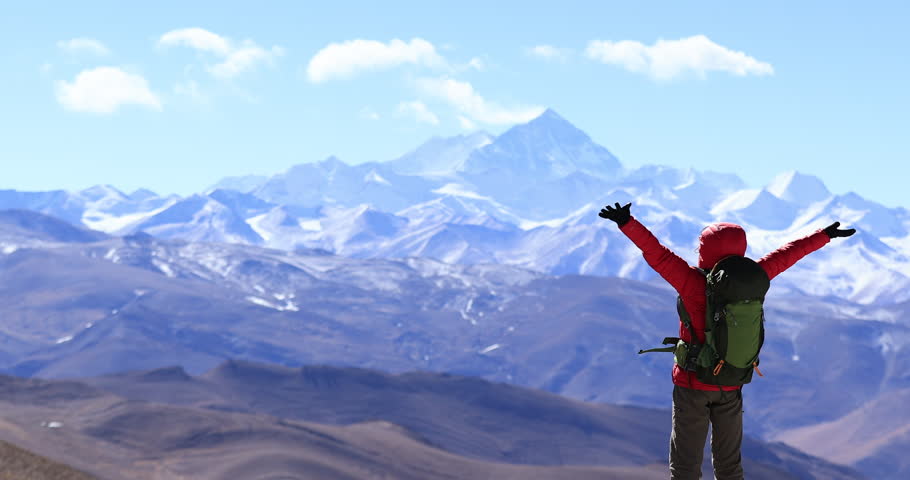 Successful woman hiker open arms to Mount Everest in Tibet, China