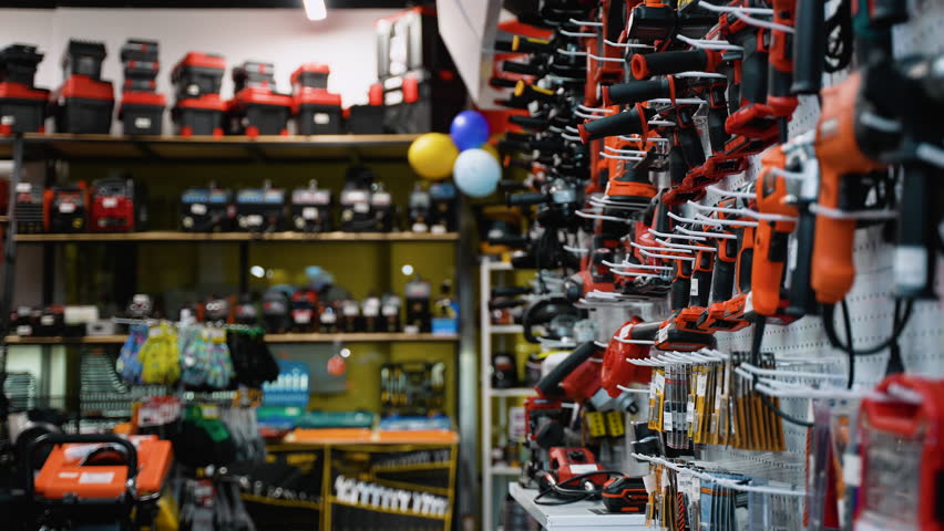 A Man Choosing a Screwdriver in Power Tool Store