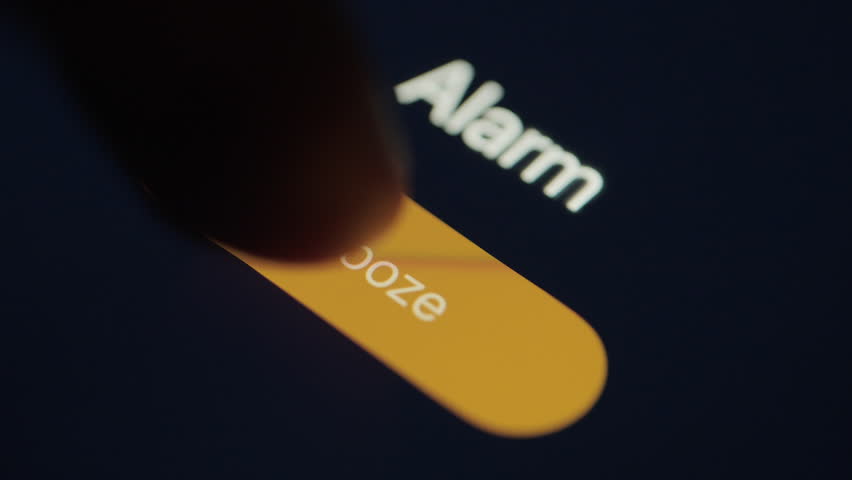 Close up of alarm going off on mobile phone