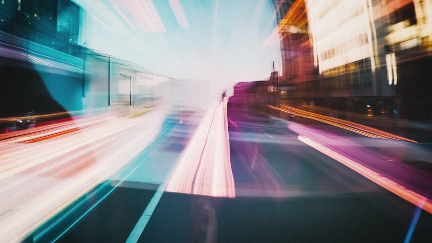 Urban fast motion point of view with long exposure city lights blurred with motion blur, traffic in the city