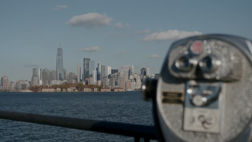 A coinoperated viewing machine offering a breathtaking skyline backdrop, perfect for travelers and curious tourists