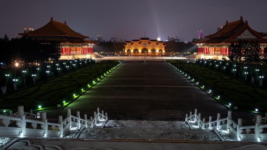 Night view of the Liberty Square with the Arch in the background in Taipei, Taiwan. A time lapse clip