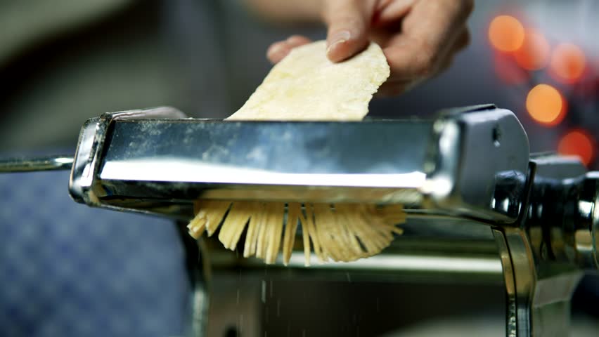 Fresh Pasta Machine Italian Food. Prepare Spaghetti And Linguine. Cooking Traditional Italian Homemade Pasta. Italian Cuisine. Make Spaghetti Or Fettuccine. Fresh Pasta Dough. Italian Food Pasta Dish