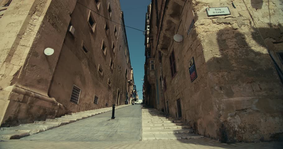 Architecture of touristic old streets in Valletta on the island of Malta. Uban landscape of the historic streets of the Mediterranean city. High quality 4k footage