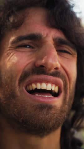 Hot Man With Beard Wipes His Sweat For A Sweltering Hot Day