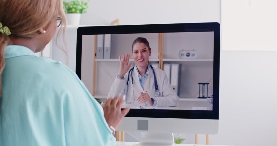 Doctor online, shoulder view young balck woman consulting with therapist doctor general practitioner via video call on computer, feeling virus illness symptoms, sharing health problems, telemedicine