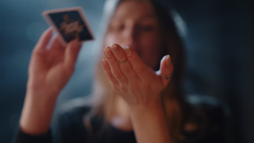 Woman Puts a Tarot Card on Her Hand