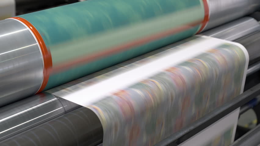 Digital printing process to create colored cover in shop. Special mechanism with rollers allows material to get necessary image for further sale