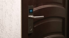Hand open hotel room door with electronic card key. Magnetic smart key to unlock doors. Protection and security system concept - Powered by Shutterstock - Get 15% off with code: PIKWIZARD15