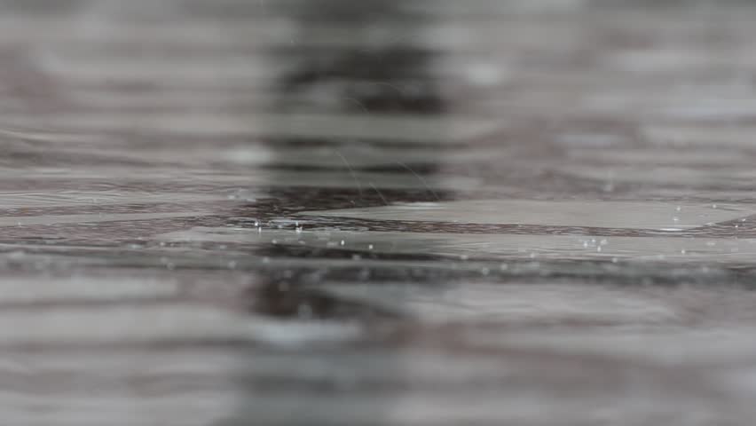 A closeup shot of heavy rain on water. Good sound!