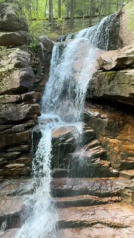 Slow motion cascading waterfall at the Flume Gorge in the Franconia Notch State Park, New Hampshire