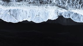 Black sand beach with crashing waves, Serene and tranquil landscape, Ocean coast with calm waves, Famous landmark of Iceland, Black sand of volcanic origin aerial view - Powered by Shutterstock - Get 15% off with code: PIKWIZARD15