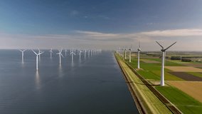 A stunning view of massive windmill turbines situated along the tranquil waters of the Netherlands. These renewable energy giants spin gracefully, contributing to sustainable power. - Powered by Shutterstock - Get 15% off with code: PIKWIZARD15