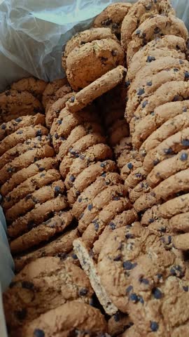 Oatmeal cookies with chocolate chips in the drawer. Cookie delivery. A pastry shop.