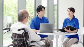 A caregiver explaining to an elderly person - Powered by Shutterstock - Get 15% off with code: PIKWIZARD15