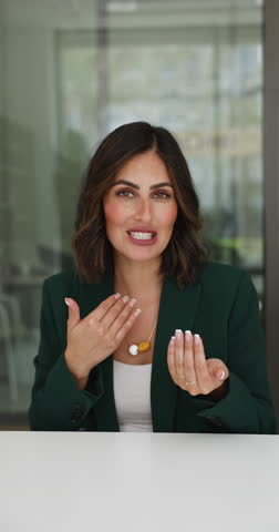 Attractive Mexican elegant businesslady lead online briefing event for staff, makes speech, provide information, plan or strategy, having digital communication through video call apps, vertical view