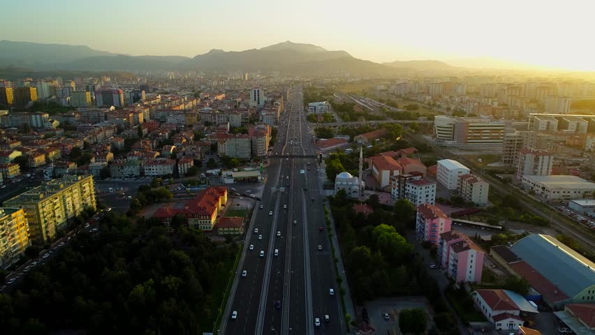 Day view of city with road junction and bridges on a sunny summer day.Junction Traffic,Aerial view sunset of highway road junction.