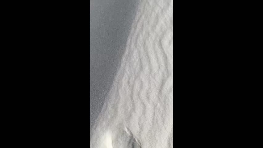 White Sands National Park in New Mexico features stunning, vast dunes of glistening white gypsum sand, offering unique landscapes for hiking, sledding, and stargazing.
