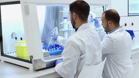 Two professional laboratory scientists in white coats working together in a modern, bright laboratory, conducting experiments and research using advanced equipment to develop new medicines - Powered by Shutterstock - Get 15% off with code: PIKWIZARD15