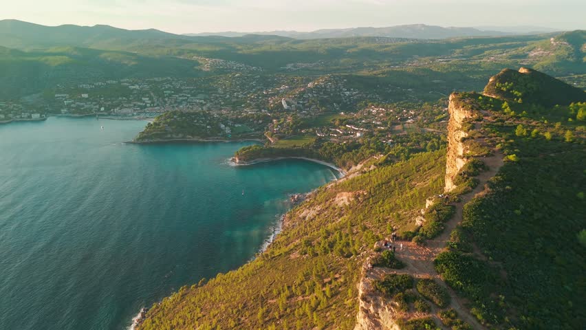Aerial view of the picturesque Route de Crete road between Cassis and La Ciotat during sunset, southern France. Stunning Meditterenean coast of sothern France with high cliffs