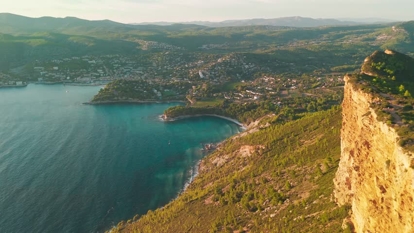 Aerial view of the picturesque Route de Crete road between Cassis and La Ciotat during sunset, southern France. Stunning Meditterenean coast of sothern France with high cliffs