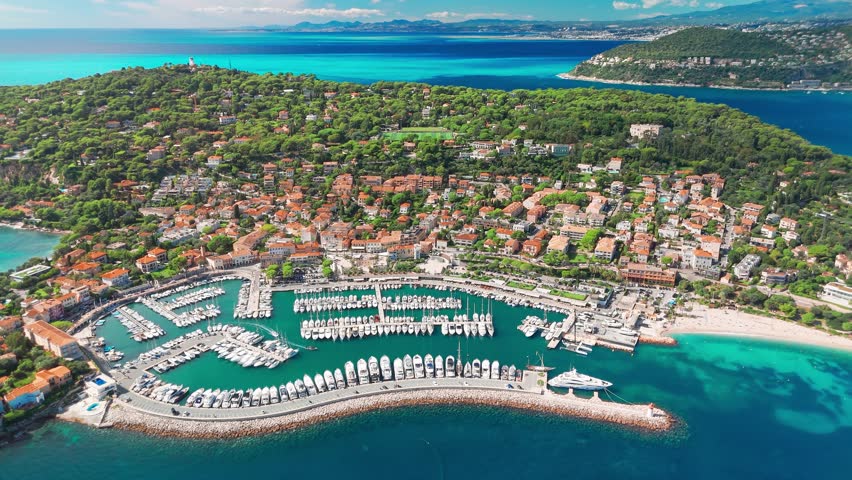 Aerial view of the Saint-Jean-Cap-Ferrat resort town on Cap Ferrat cape at French Riviera of Mediterranean Sea. Harbour of Saint Jean Cap Ferrat, France. Luxury travel destination in Cote dAzur