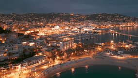 Aerial view of the Cannes at night, Cote d'Azur, southern France. Cannes cityscape during the summer on the French Riviera.  - Powered by Shutterstock - Get 15% off with code: PIKWIZARD15