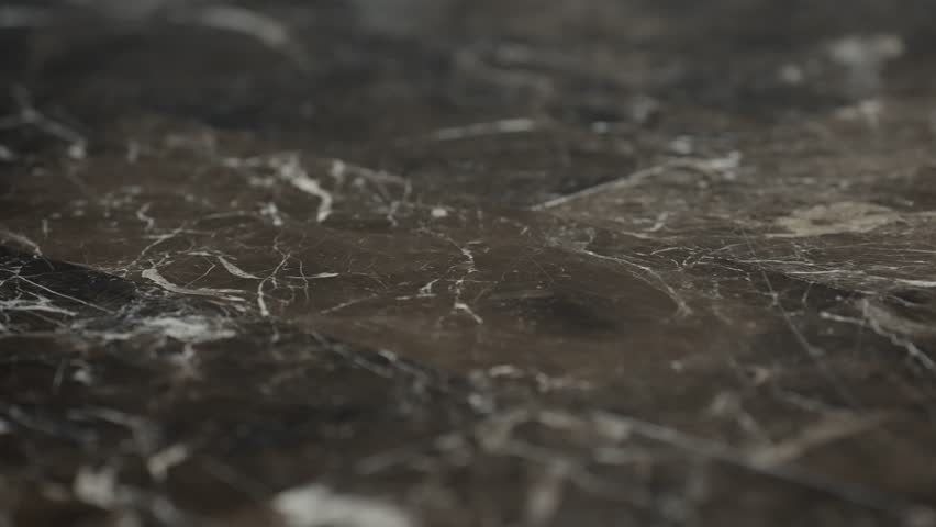 Close up view of a glossy surface marble floor, The design features shades of white, gray, Emphasizing the luxurious and elegant appearance of the polished marble texture