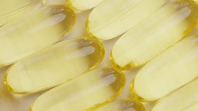 Close-Up View of Yellow Gel Capsules in Rows - Powered by Shutterstock - Get 15% off with code: PIKWIZARD15