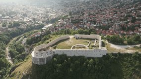 Aerial footage of the White Fort also known as the Bijela Tabija, a historic fortification overlooking the city of Sarajevo, Bosnia and Herzegovina. Flying backwards. - Powered by Shutterstock - Get 15% off with code: PIKWIZARD15