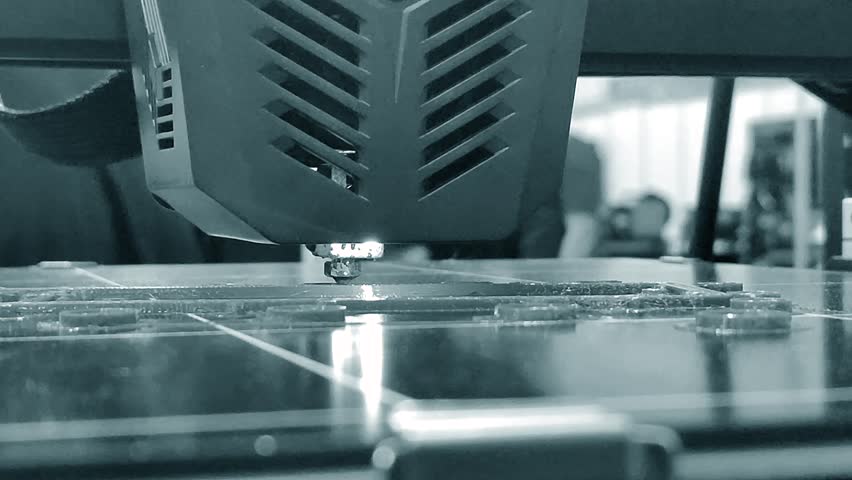 The process of printing on a 3D printer. 3D printer printing object from molten plastic close-up. Creative creation of model on 3D printer. New modern technologies of 3D printing. Additive technology