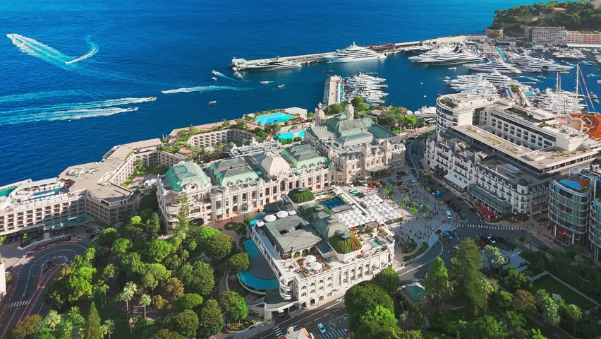 Aerial view of the Monte-Carlo casino in Monaco. Luxurious supercars in front of the hotel. City center of the Principality of Monaco. Famous casino and luxury buildings in Monte Carlo, Monaco