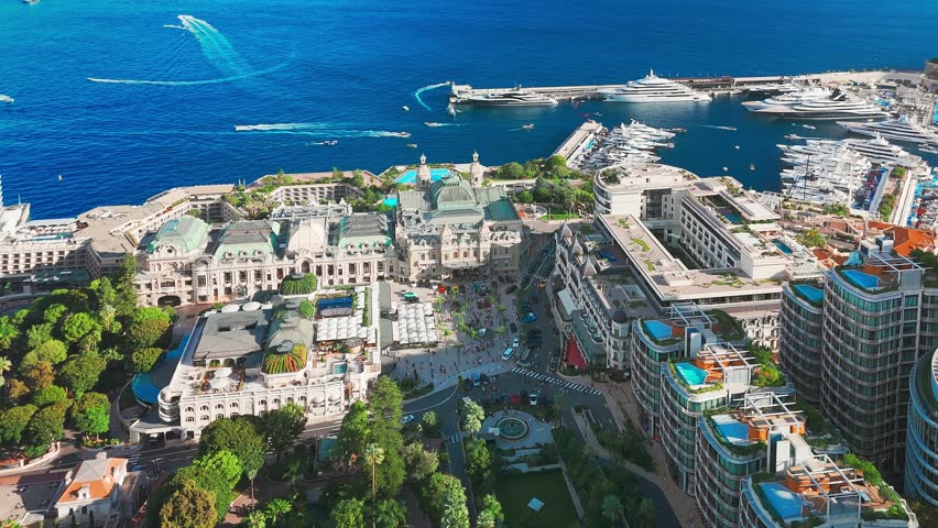 Aerial view of the Monte-Carlo casino in Monaco. Luxurious supercars in front of the hotel. City center of the Principality of Monaco. Famous casino and luxury buildings in Monte Carlo, Monaco