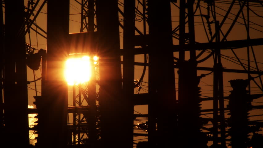 Sun falling in a electrical station. Time Lapse