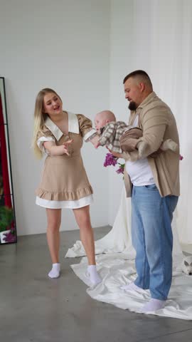 Happy parents playing with their child. Concept of parent-child interaction.