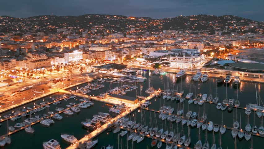 Aerial view of the Cannes at night, Cote d'Azur, southern France. Cannes cityscape during the summer on the French Riviera. 