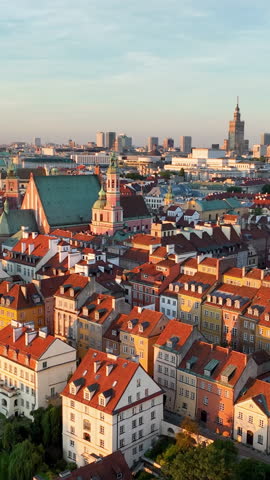 Aerial Vertical view of Warszawa cityscape. Old town and modern skyscrapers at sunrise, Royal Castle. Poland.