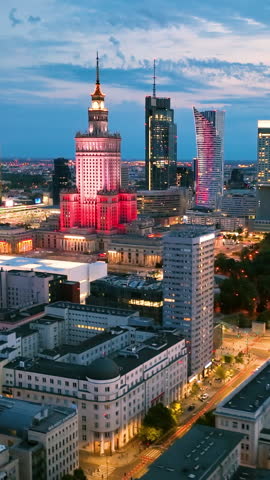 Aerial Vertical view of Warszawa cityscape. Old town and modern skyscrapers at sunrise, Royal Castle. Poland.