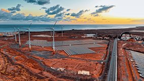 This aerial perspective showcases large solar panels and wind turbines in Gran Canaria, Spain, highlighting the region's commitment to sustainable energy practices. - Powered by Shutterstock - Get 15% off with code: PIKWIZARD15
