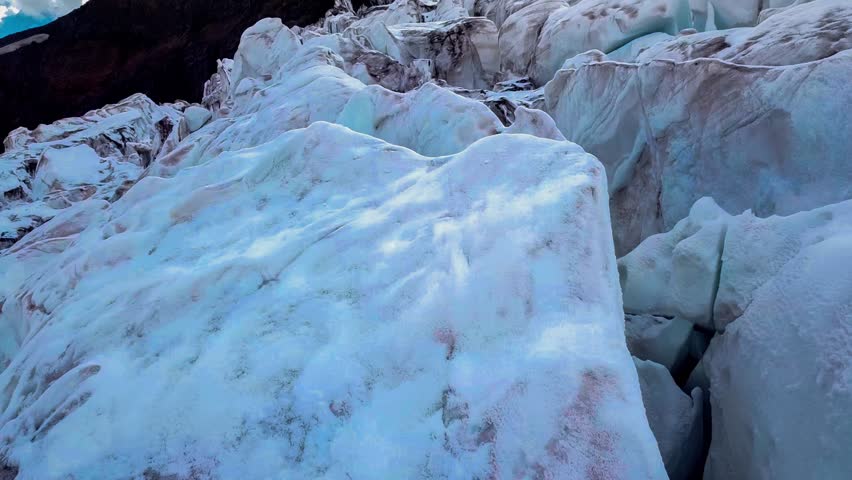 Aerial drone view of the glacier and snow-capped mountain peaks. Elbrus, North Caucasus, Karachay-Cherkessia. High quality 4k footage