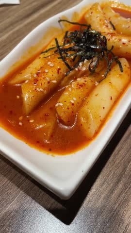 A plate of Spicy Korean Rice Cakes or Tteokbokki.  