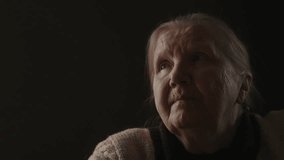 Senior woman sitting indoor with soft window light - Powered by Shutterstock - Get 15% off with code: PIKWIZARD15