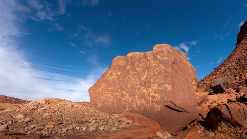 Time lapse of cloud over Inscription on the rock by Nabatean in Tabuk, Alula, Saudi Arabia