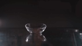 pour caramel popcorn into a small plate at night dark background close up - Powered by Shutterstock - Get 15% off with code: PIKWIZARD15