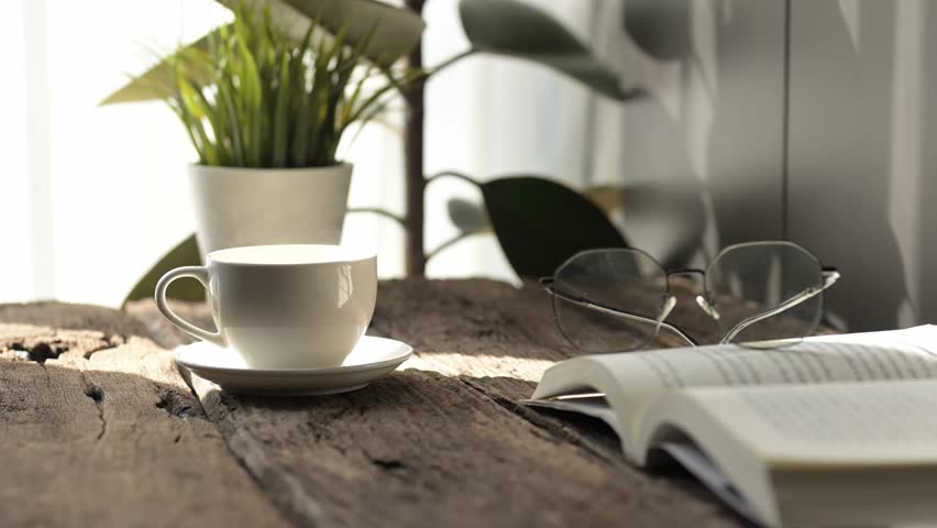 Savoring slow motion hot coffee and espresso moments in a cozy reading nook with a mug plants and an open book