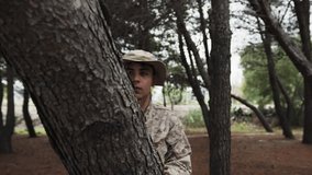 Young Military Man Hides From The Enemy Behind A Log In The Forest In War Terror - Powered by Shutterstock - Get 15% off with code: PIKWIZARD15