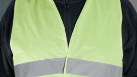 Blue collar worker expressing fear of job loss due to AI automation. Factory employee holding emotional handwritten protest sign. Human workforce concerns in reflective safety vest close up - Powered by Shutterstock - Get 15% off with code: PIKWIZARD15