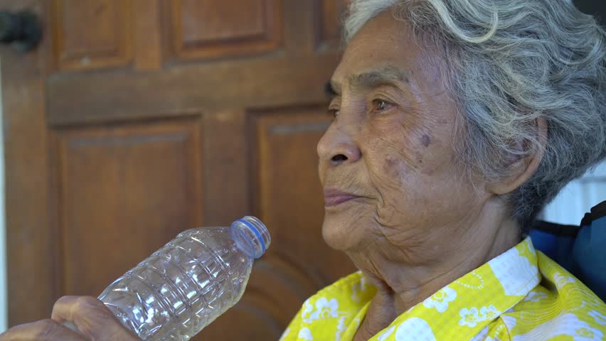 Elderly people drink a water